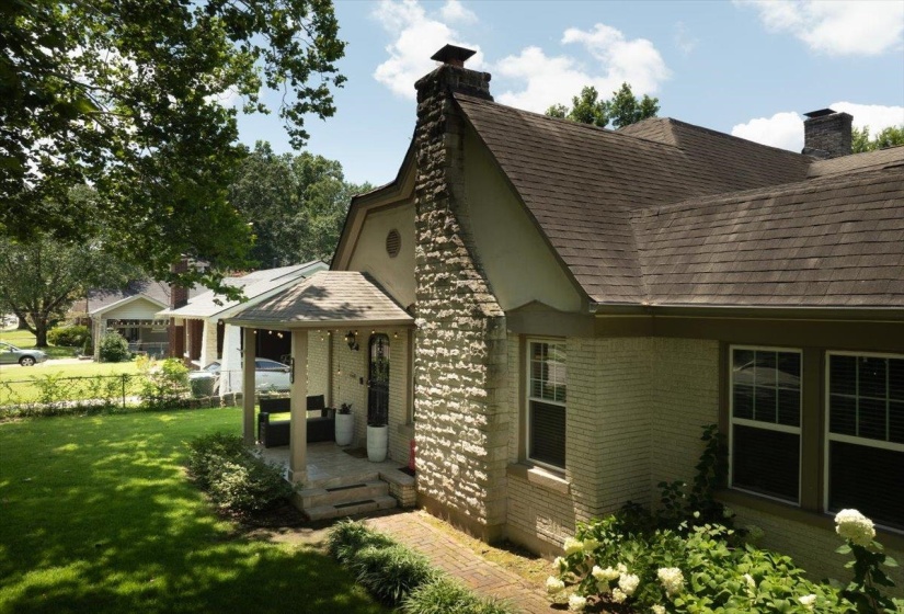 Brick exterior with stone chimney and gabled rooflines