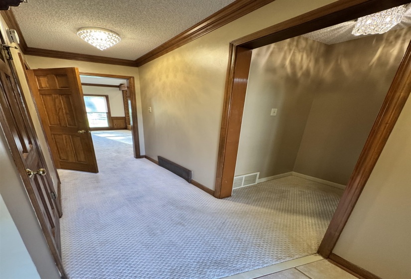 Front Entrance to master bedroom and hallway to great room. Left is half bath and a closet.