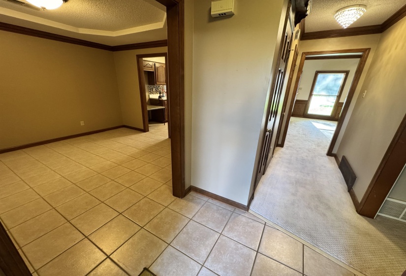 Left is dinning room. Straight is to great room. Half restroom is on the left to great room. Right is master bedroom.