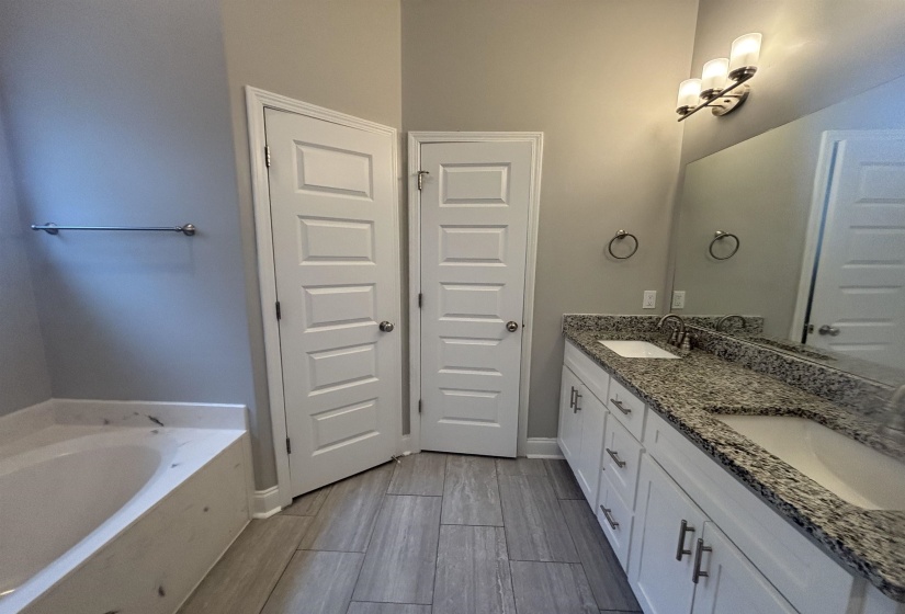 Dual vanity with granite countertop and undermount sinks