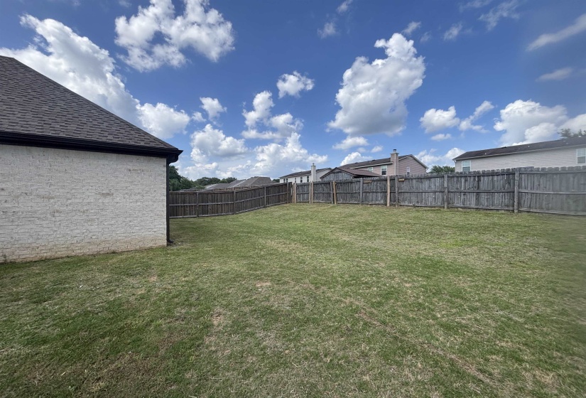 Expansive backyard with a full privacy fence