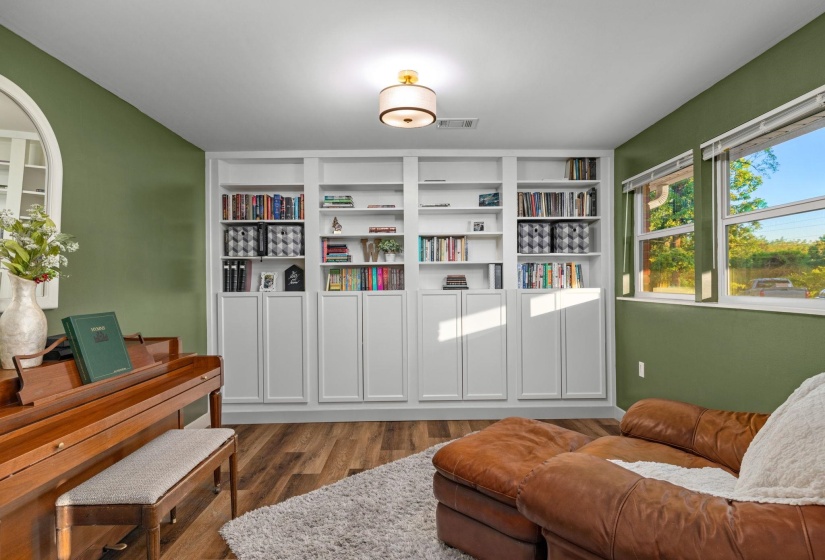 Built-in shelving with lower cabinetry provides extensive storage