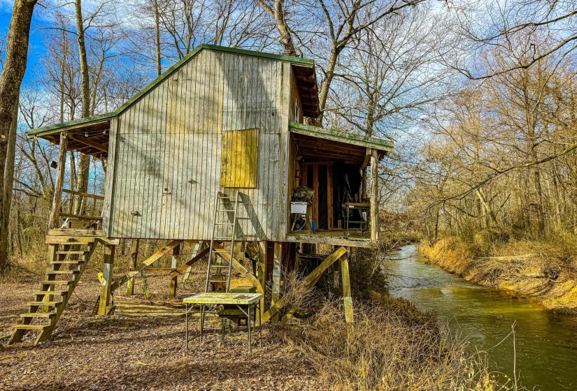 View of outbuilding with a water view