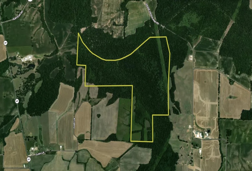 Aerial map of property and surrounding area featuring property parcel outlined