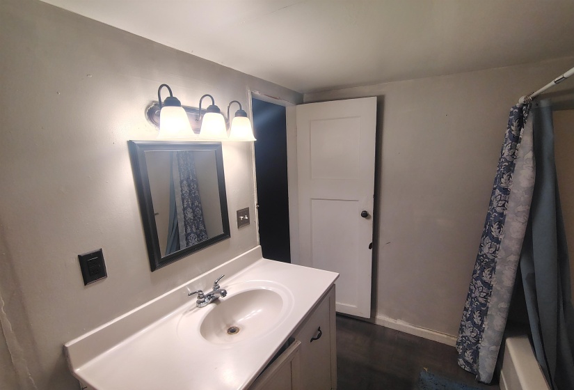 Vanity with an integrated sink and chrome faucet
