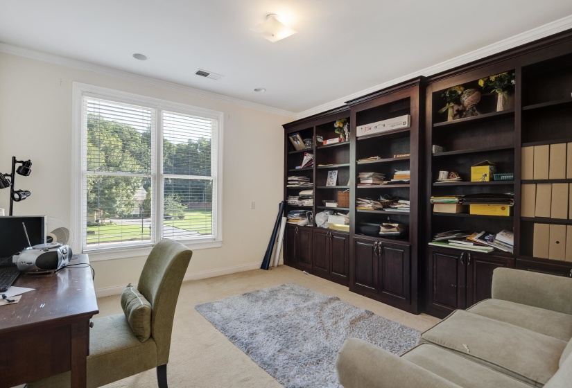 Built-in shelving with lower cabinetry provides extensive storage and display
