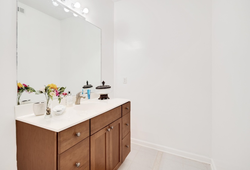 Integrated vanity with a white countertop and undermount sink