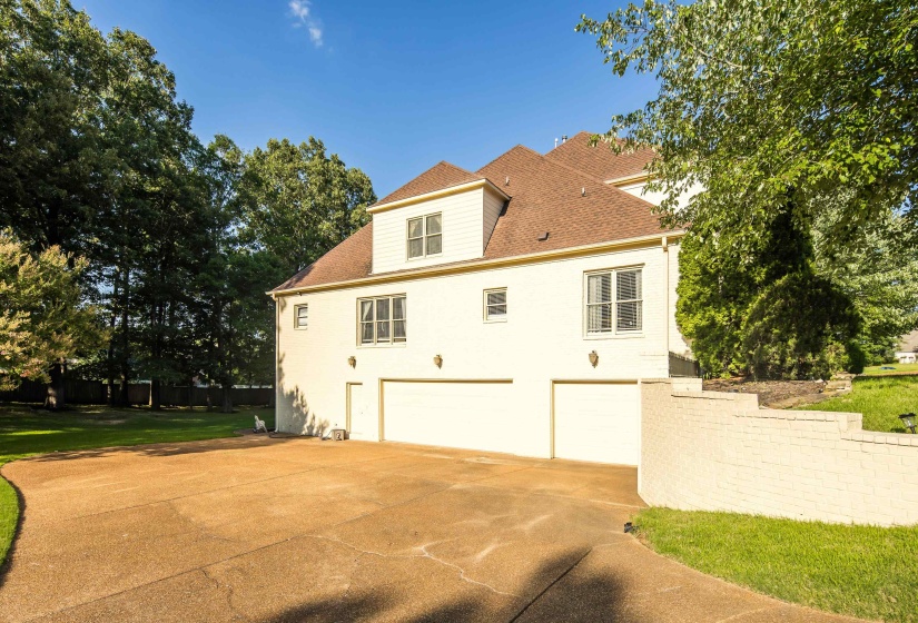 Spacious concrete driveway offering ample parking