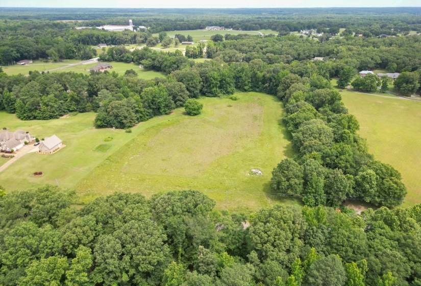 A closer look at the property's expansive homesite, offering open space, privacy, and endless possibilities for your future home and outdoor living areas.