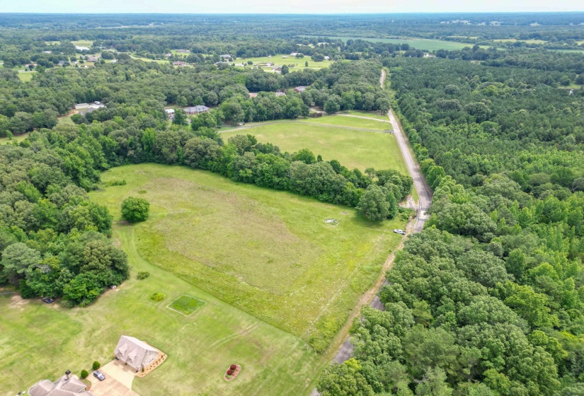 With plenty of room to build, this beautiful tract offers space for a custom home, workshop, pool, gardens, and more.
