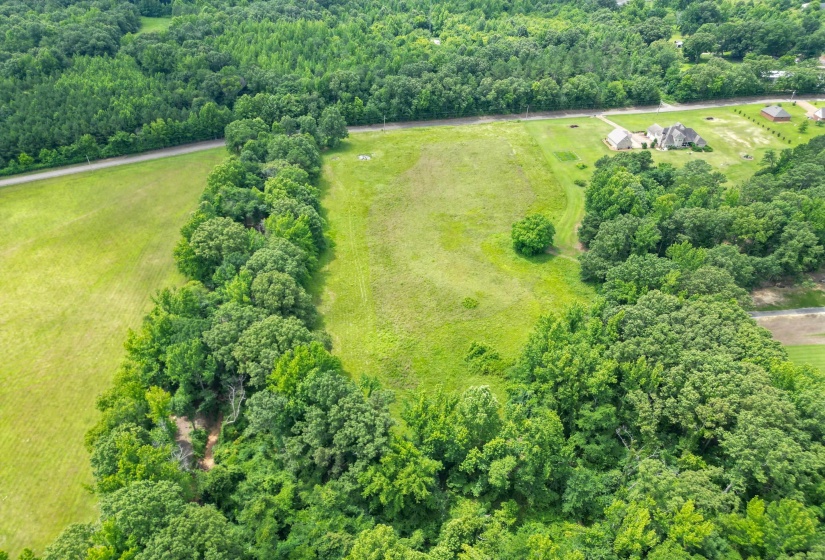 Wide-open spaces and peaceful countryside views make this property an exceptional opportunity for those seeking privacy and room to grow.