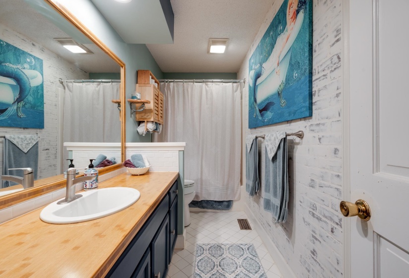 Downstairs bathroom is between bedrooms 2 and 3
