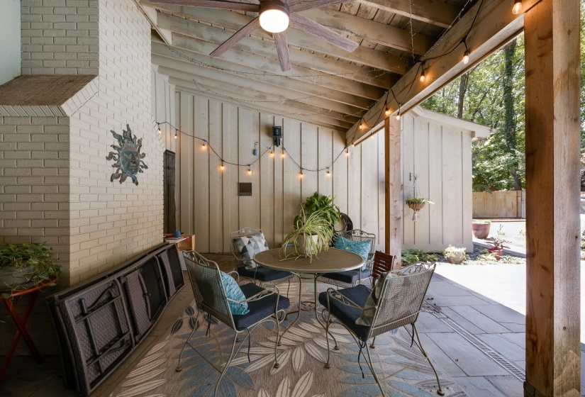 Overlooking the sparkling inground pool is the covered patio