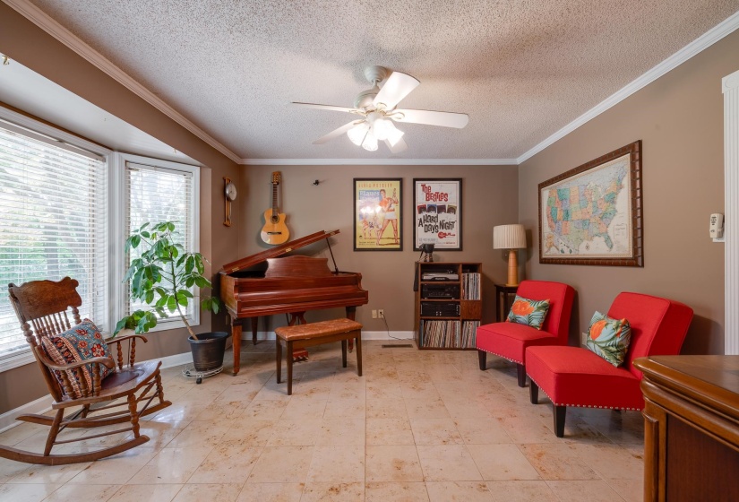 Marble tile floors and a bright bay window seat