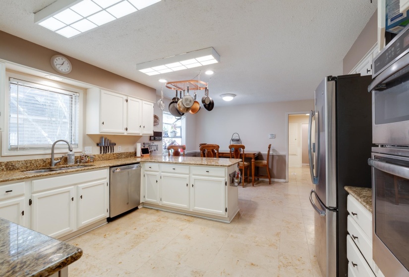 New stainless appliances and fresh cabinets plus marble tile floor makes this room the favorite room in the house!