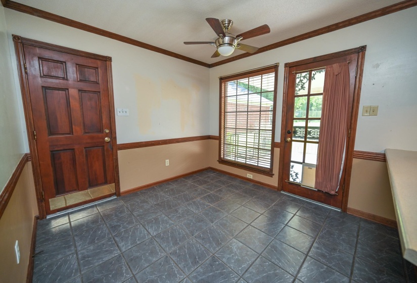 Doors lead to garage and back covered patio.