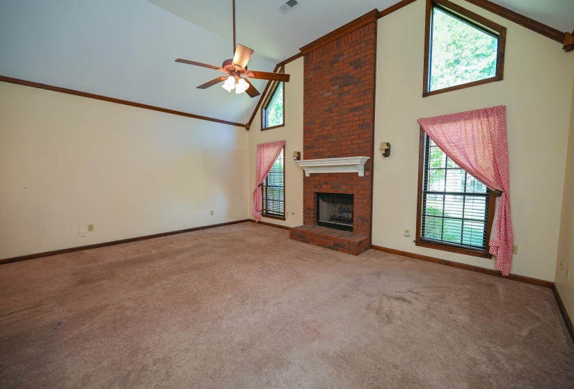 Vaulted 13' ceiling with gas fireplace.