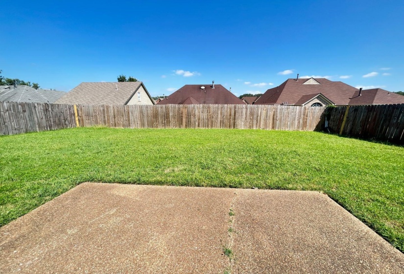 View of fenced backyard