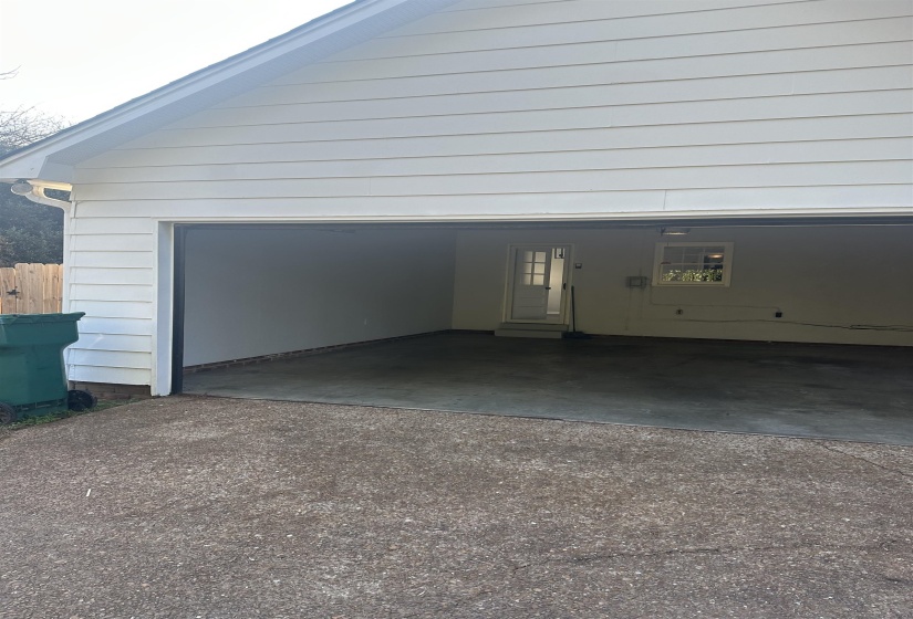 Garage with dirt driveway