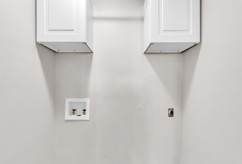 Laundry area featuring cabinet space, hookup for a washing machine, and electric dryer hookup