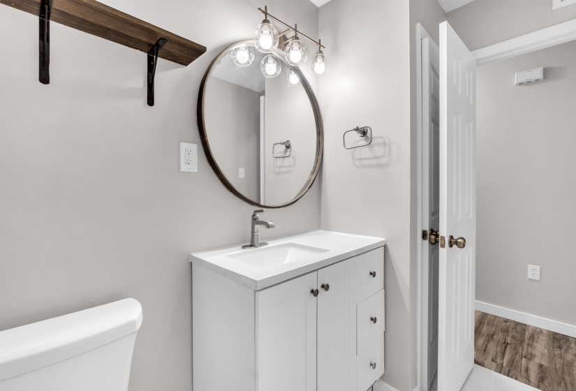 Bathroom with vanity and light wood finished floors