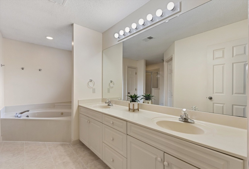 Dual vanity with integrated sinks and ample storage cabinetry