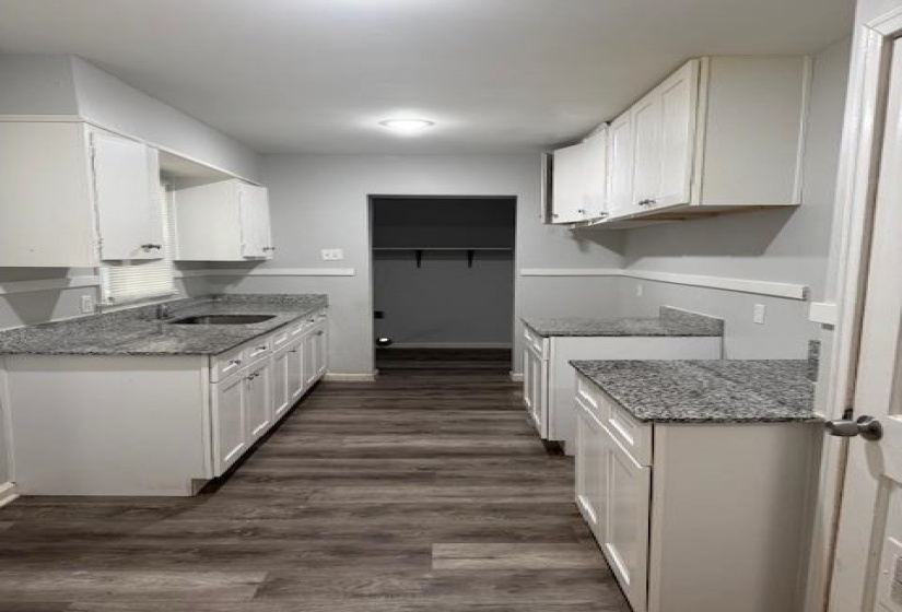 Kitchen with custom exhaust hood