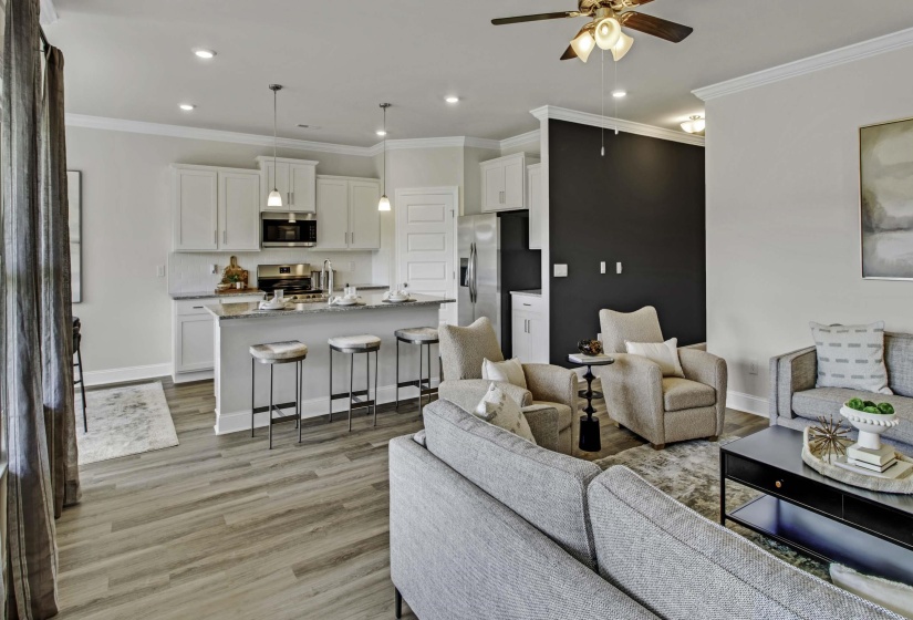 Living room with ceiling fan, crown molding, light wood finished floors, and recessed lighting