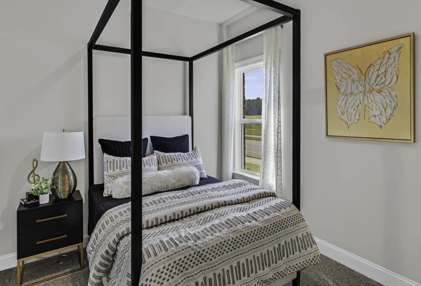 Bedroom with baseboards and carpet floors