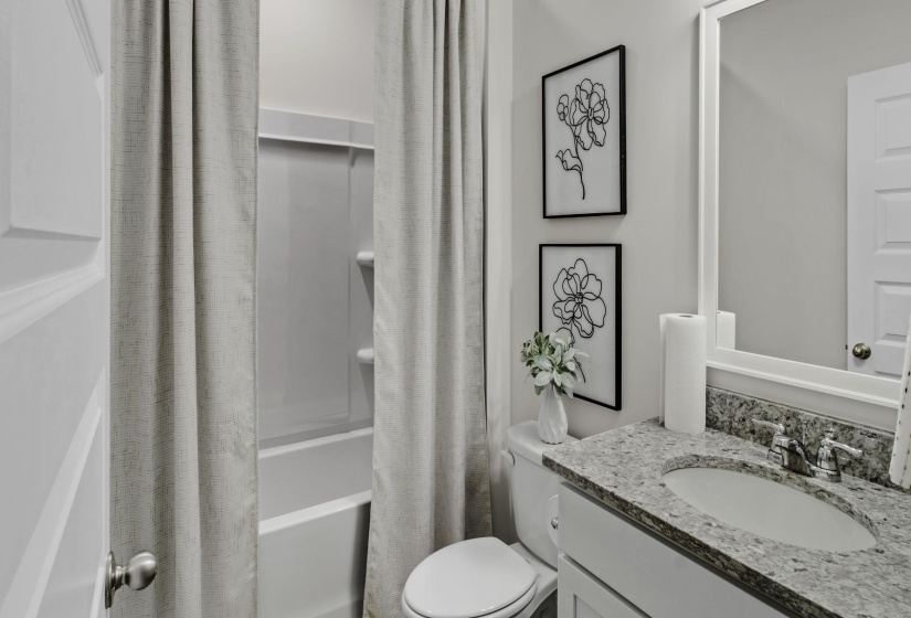 Full bathroom featuring vanity and shower / bath combination with curtain