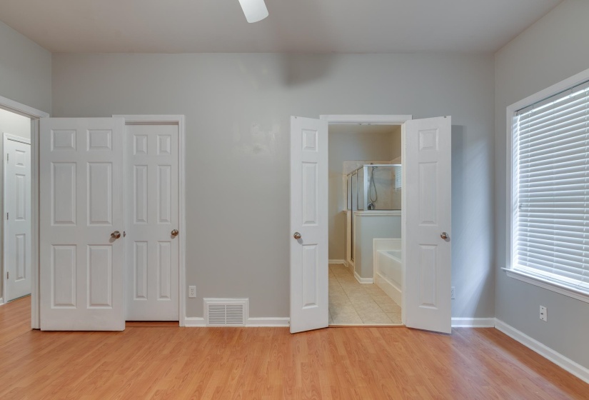 Room featuring wood-finish flooring and light gray walls