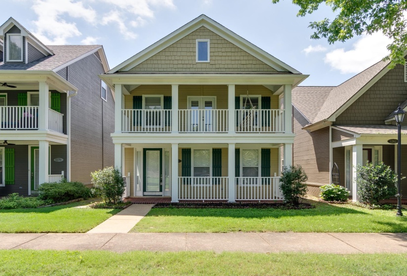 Two-story residence featuring a prominent front gable and neutral-toned siding