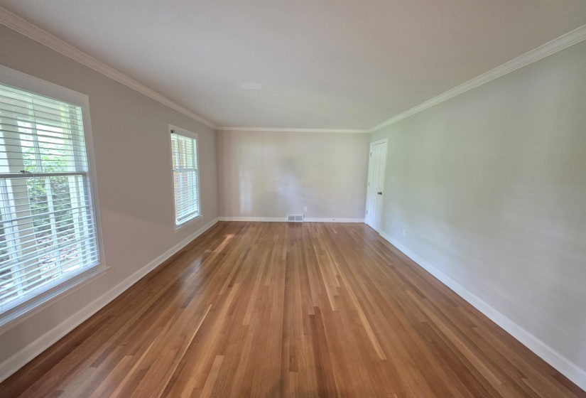 Hardwood flooring paired with light-toned walls