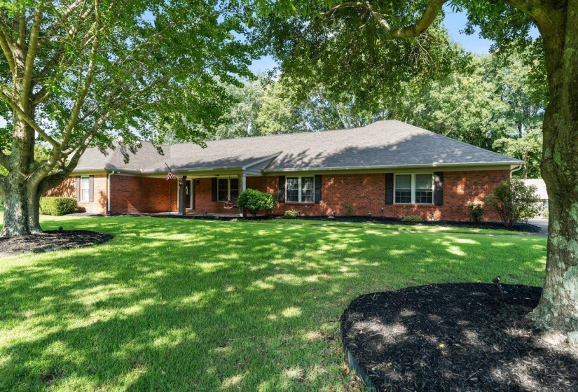 Brick exterior with a two year old roof and a covered front porch featuring white columns