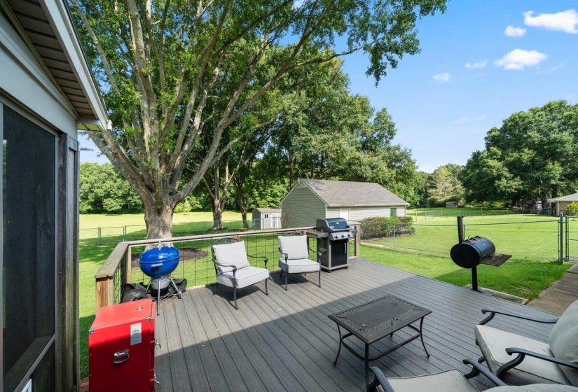 Spacious outdoor deck featuring composite decking and metal railings