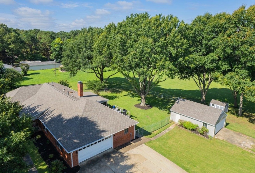 Brick residence with a multi-gabled roofline and an attached garage