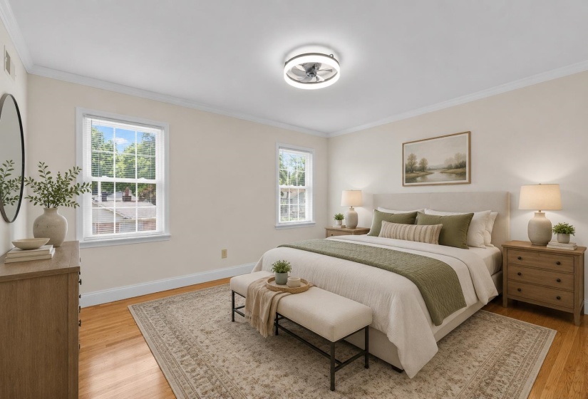 Well-proportioned bedroom offering hardwood floors, natural light, and ample space for guests, hobbies, or a growing household. This photo has been virtually staged.