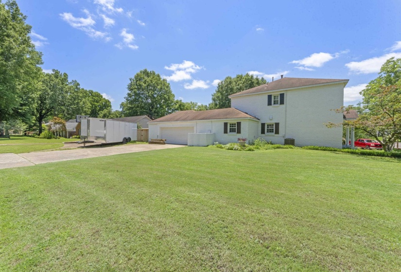 Situated on a generous corner lot with side-entry garage, ample parking, and mature landscaping.