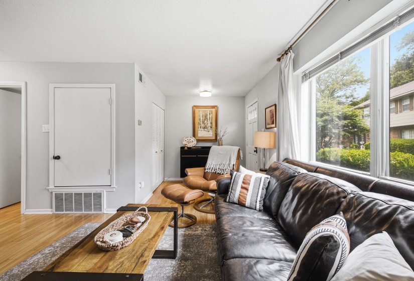 Front door is to the right and coat closet is on the left across from the door.
