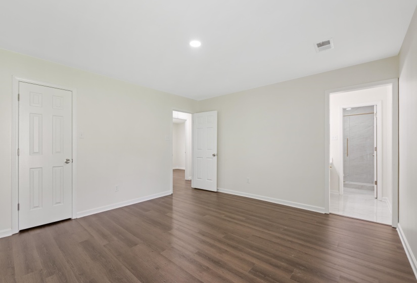 Another view of the primary bedroom.