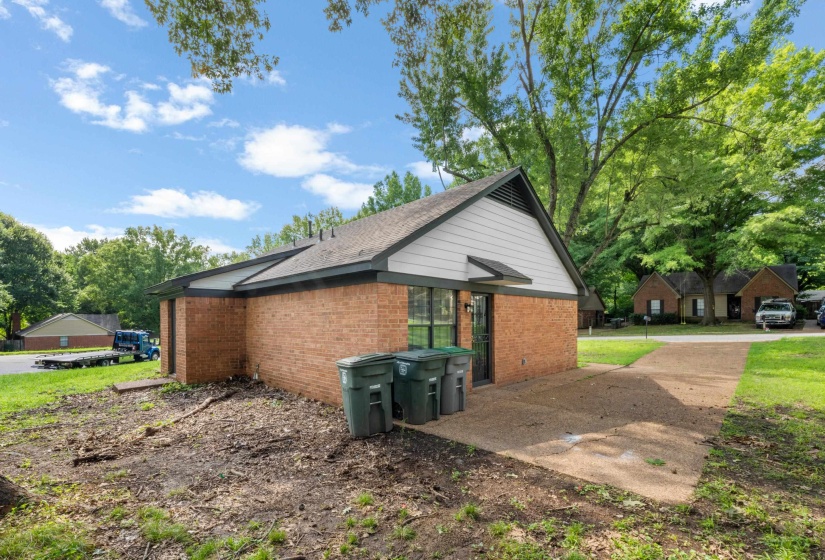 Durable brick construction, mature trees, and ample outdoor space create a comfortable setting with room to enjoy the outdoors year-round.