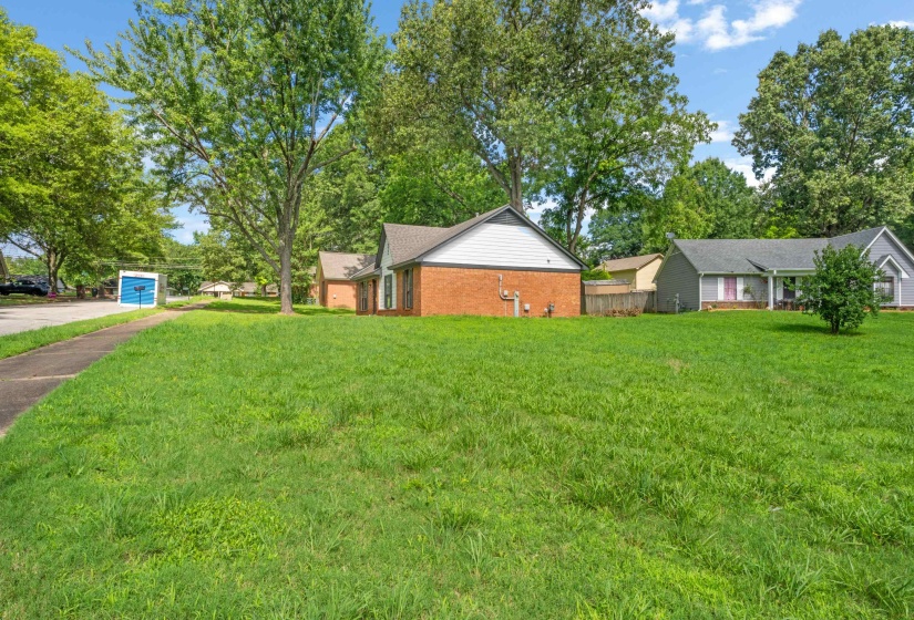 Enjoy a wide-open yard with abundant green space, providing flexibility for recreation, play, outdoor gatherings, or landscaping opportunities.