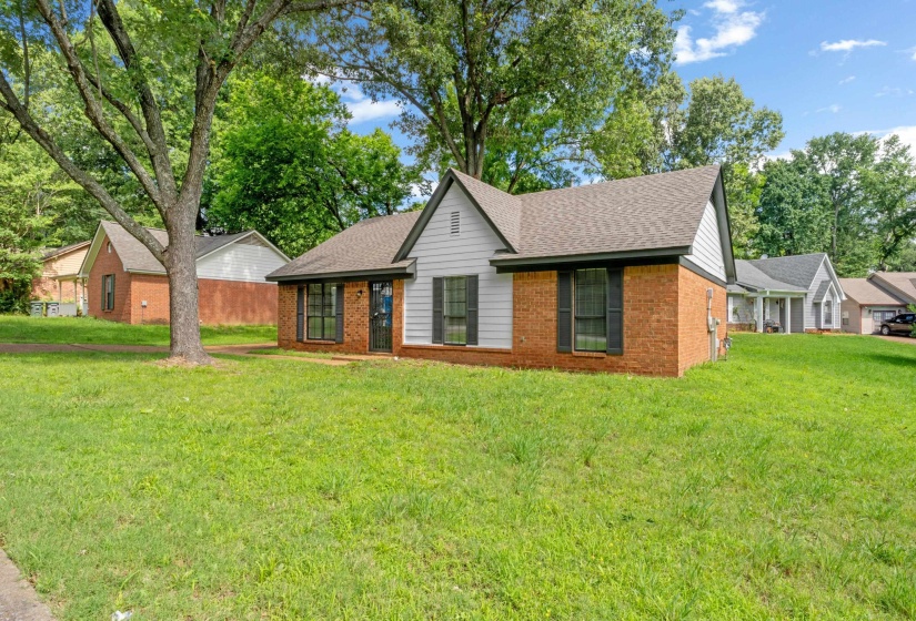 Attractive brick exterior with updated paint, mature shade trees, and welcoming curb appeal that makes a lasting first impression.