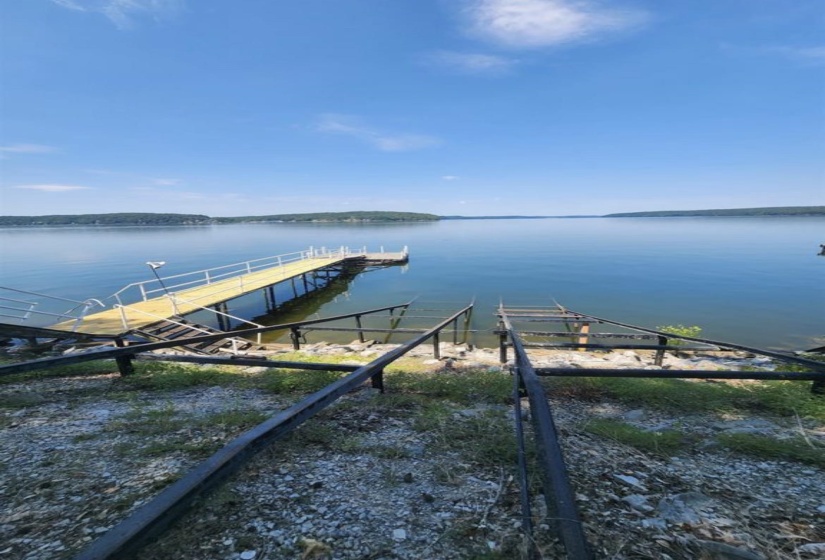 Private dock extending into calm waters