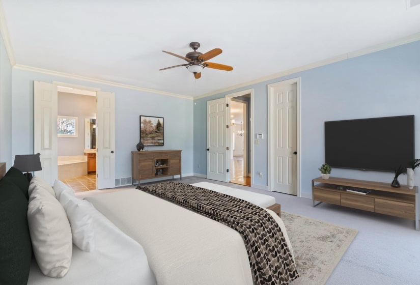 Bedroom featuring crown molding, connected bathroom, a ceiling fan, and light colored carpet