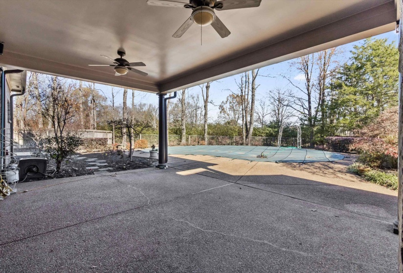 View of patio featuring ceiling fan