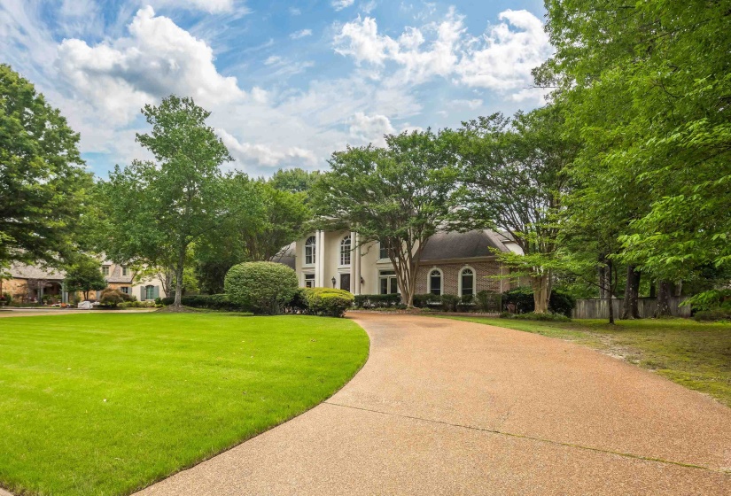 Grand Southern architecture featuring a columned portico and arched windows