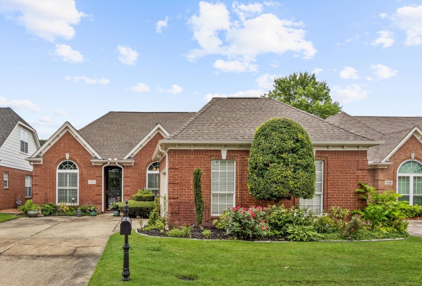 Brick facade residence with a gabled roofline
