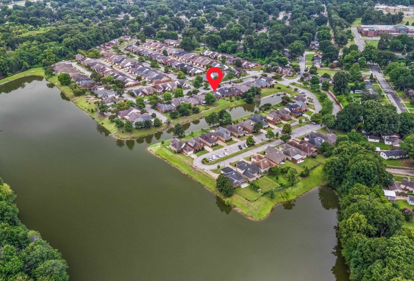 Aerial perspective showcasing a residential community with numerous homes
