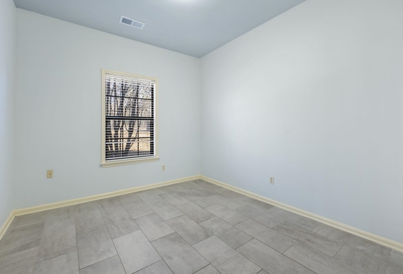 Unfurnished room featuring baseboards
